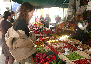 lady looking at fresh fruit and vegetables